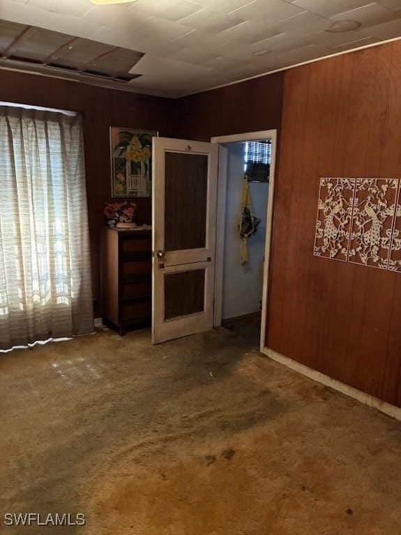 2994 Price Ave, Fort Myers, FL 33916 - spare room with wood walls and carpet flooring
