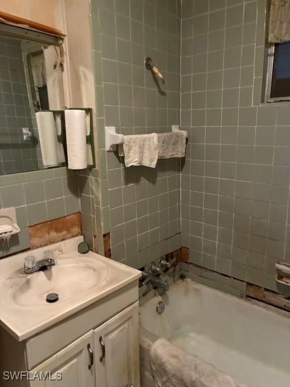 2994 Price Ave, Fort Myers, FL 33916 - full bath with vanity, tub / shower combination, and tile walls