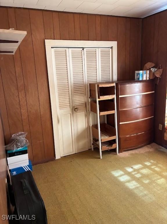 2994 Price Ave, Fort Myers, FL 33916 - unfurnished bedroom with carpet and wood walls