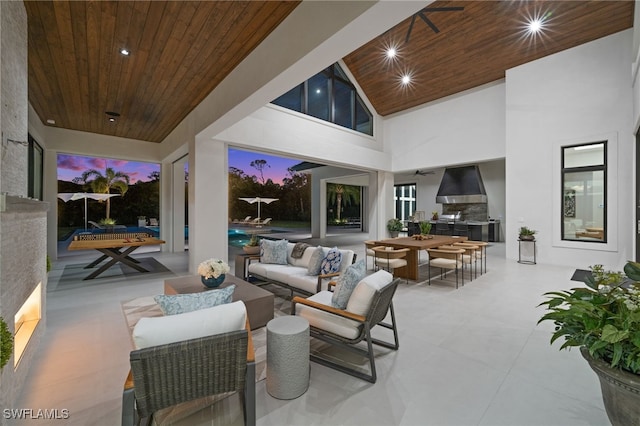 115 E Ave, Naples, FL 34108 - view of patio featuring an outdoor living space, exterior kitchen, ceiling fan, and an outdoor pool