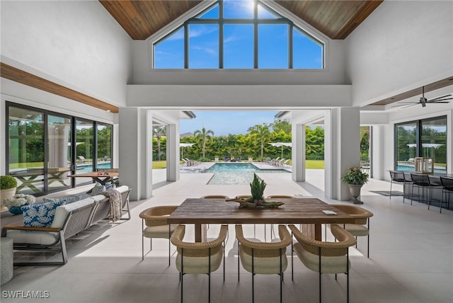 115 E Ave, Naples, FL 34108 - sunroom featuring vaulted ceiling and plenty of natural light