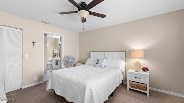 carpeted bedroom featuring baseboards, connected bathroom, a closet, and a ceiling fan