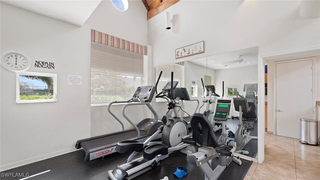 workout room with a towering ceiling