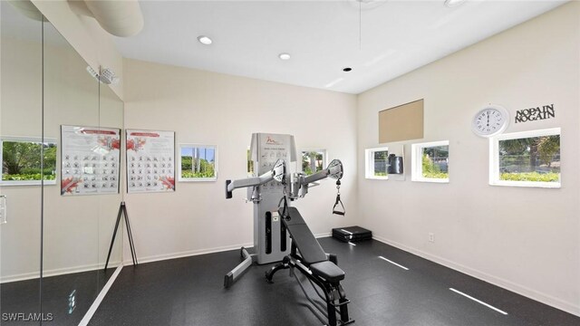 exercise room featuring recessed lighting and baseboards