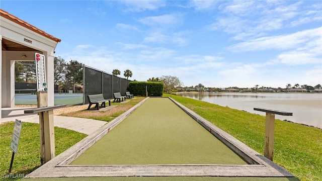 view of community featuring a bocce ball area and a water view