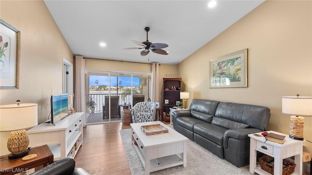 living room featuring ceiling fan, wood finished floors, lofted ceiling, and recessed lighting