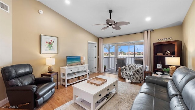 living room with ceiling fan, light wood-style flooring, lofted ceiling, recessed lighting, and baseboards
