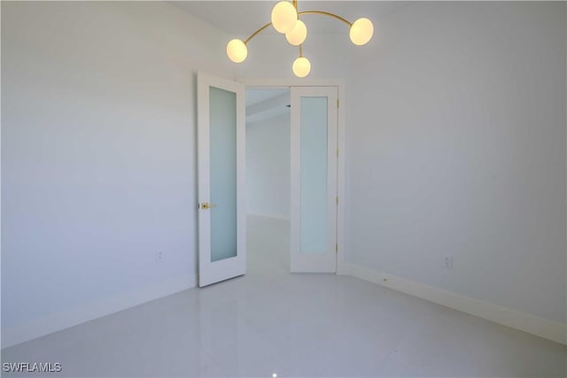 empty room featuring baseboards