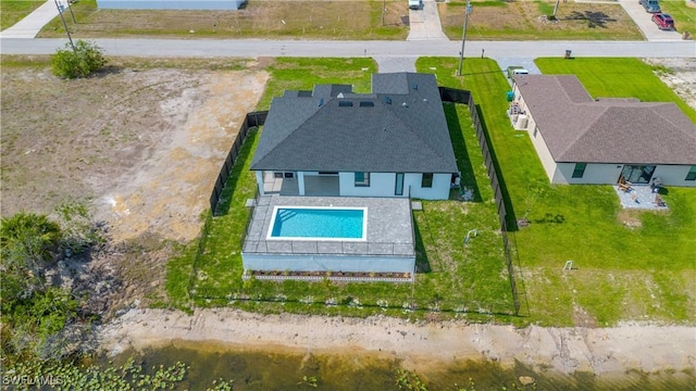 aerial view of property and surrounding area featuring a pool area