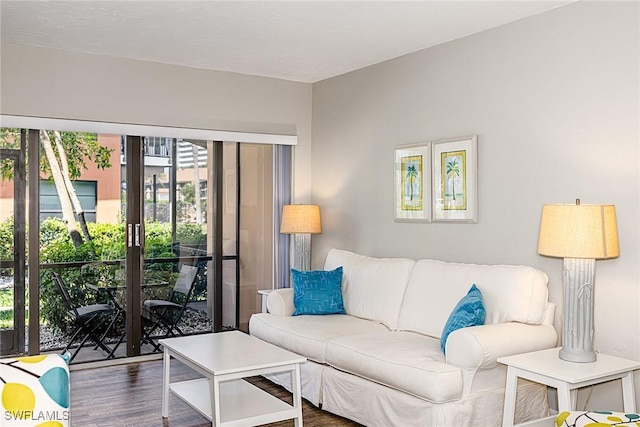 20 Greenbrier St Unit 3-105, Marco Island, FL 34145 - living area featuring dark wood-style flooring and french doors