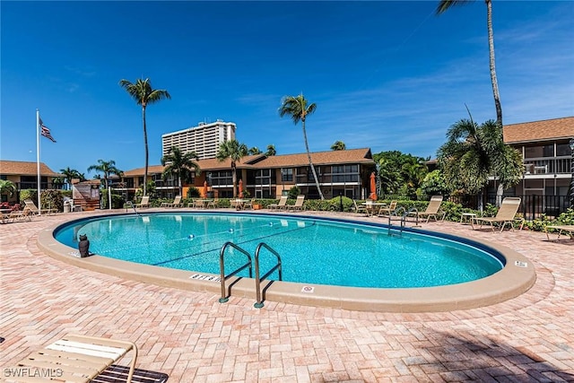 20 Greenbrier St Unit 3-105, Marco Island, FL 34145 - community pool featuring fence and a patio