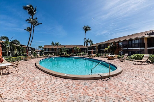 20 Greenbrier St Unit 3-105, Marco Island, FL 34145 - community pool featuring a patio area