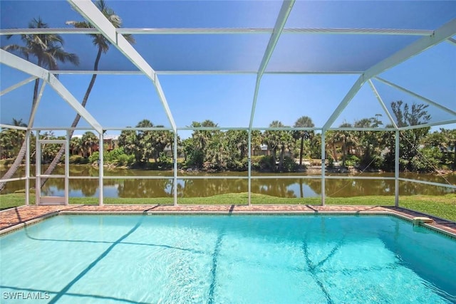 swimming pool with glass enclosure and a water view
