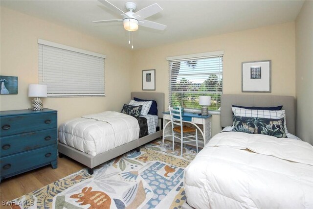bedroom featuring wood finished floors and a ceiling fan