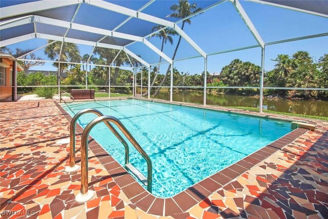 outdoor pool featuring a water view, a lanai, and a patio