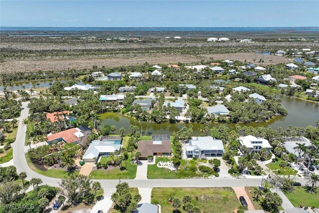 aerial overview of property's location with nearby suburban area and a large body of water