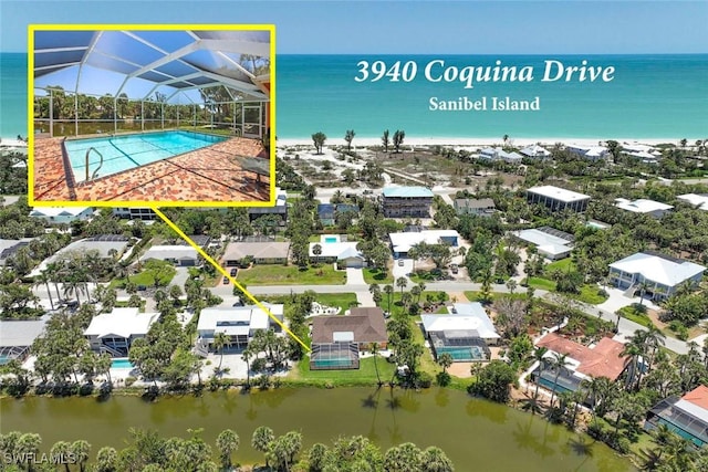 aerial perspective of suburban area with a nearby body of water and property parcel outlined