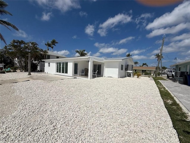2823 Janet St, Matlacha, FL 33993 - rear view of property featuring a patio and stucco siding