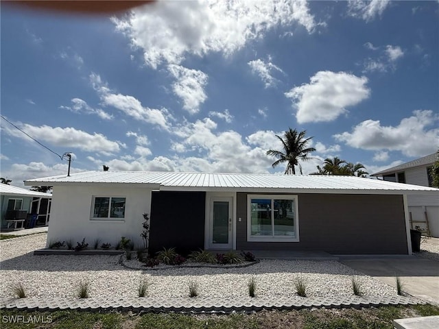 2823 Janet St, Matlacha, FL 33993 - single story home featuring metal roof and stucco siding