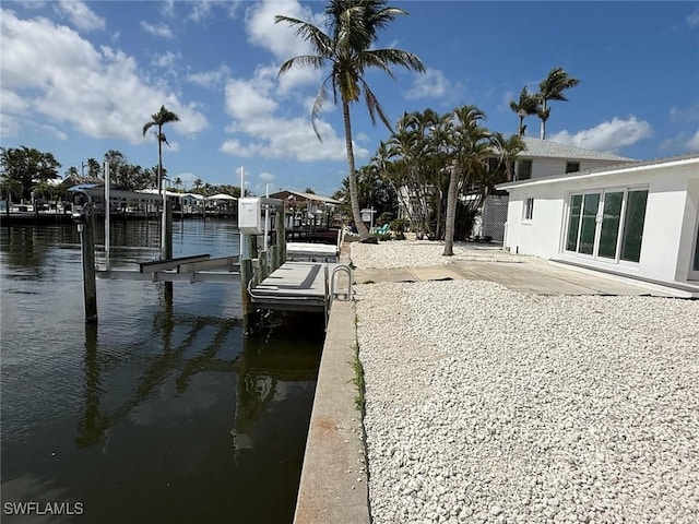 2823 Janet St, Matlacha, FL 33993 - dock area featuring a water view, boat lift, and a patio