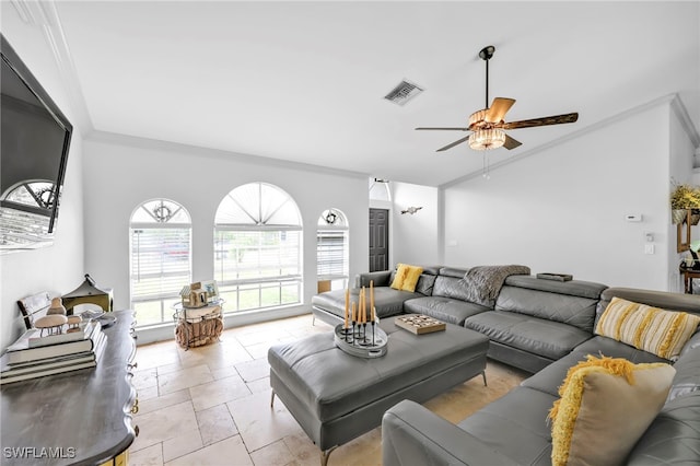 3570 43rd Ave NE, Naples, FL 34120 - living room featuring a ceiling fan, crown molding, and stone tile flooring