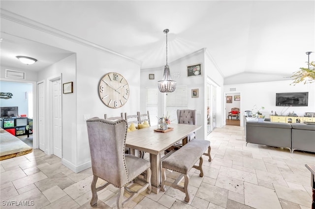 3570 43rd Ave NE, Naples, FL 34120 - dining room featuring stone tile flooring, a chandelier, baseboards, lofted ceiling, and crown molding
