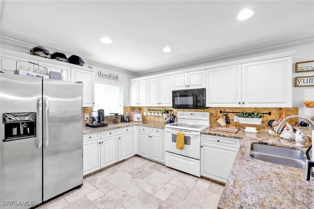 3570 43rd Ave NE, Naples, FL 34120 - kitchen with stainless steel fridge, white range with electric cooktop, black microwave, a sink, and crown molding