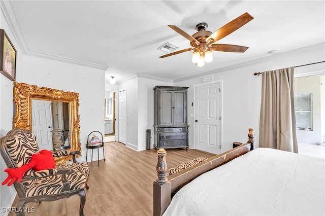 3570 43rd Ave NE, Naples, FL 34120 - bedroom with ornamental molding, light wood-type flooring, baseboards, ensuite bathroom, and a ceiling fan