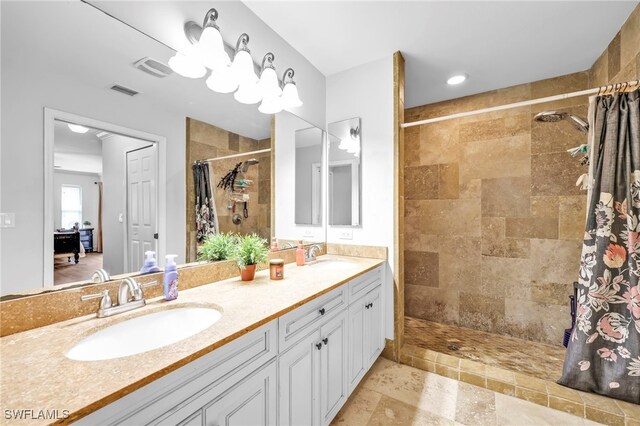 3570 43rd Ave NE, Naples, FL 34120 - bathroom featuring tiled shower and double vanity