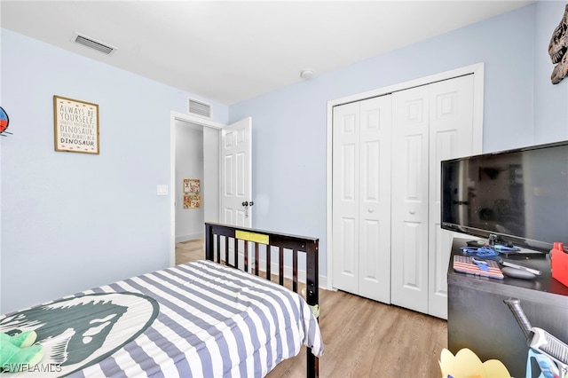 3570 43rd Ave NE, Naples, FL 34120 - bedroom featuring light wood-type flooring and a closet