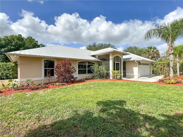 3790 35th Ave NE, Naples, FL 34120 - ranch-style house featuring stucco siding, an attached garage, a front yard, and a metal roof