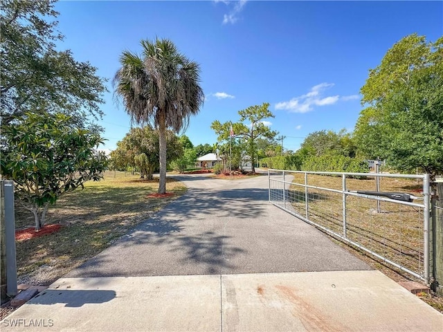 3790 35th Ave NE, Naples, FL 34120 - view of asphalt driveway with a gate and a gated entry
