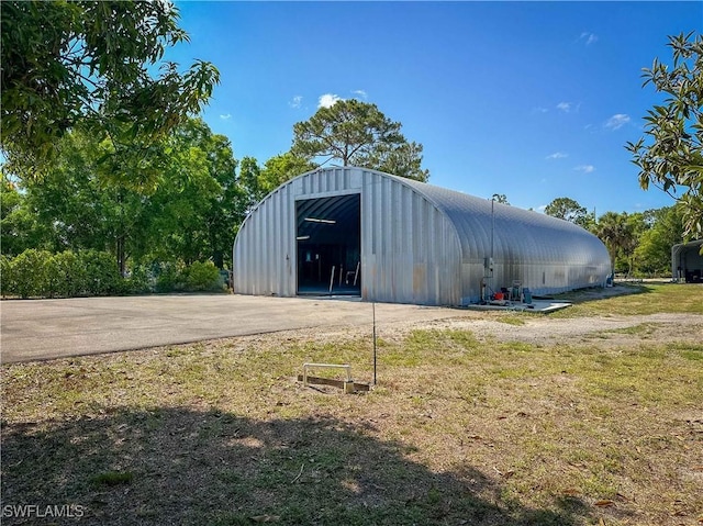 3790 35th Ave NE, Naples, FL 34120 - view of pole building with a lawn and driveway