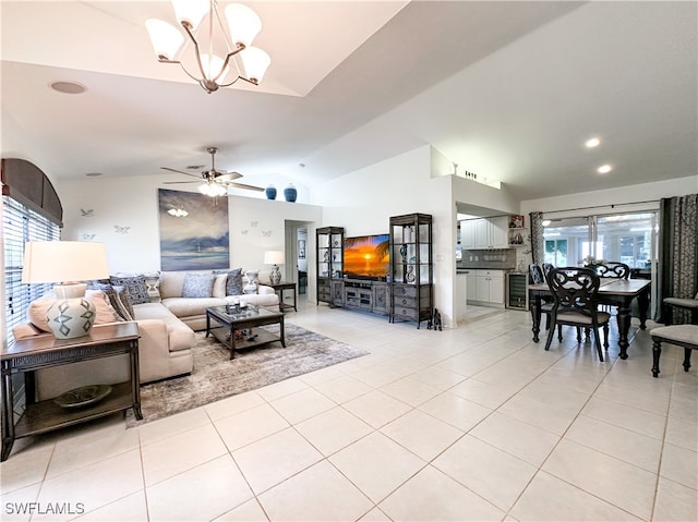 3790 35th Ave NE, Naples, FL 34120 - living room with vaulted ceiling, light tile patterned floors, plenty of natural light, a chandelier, and a ceiling fan