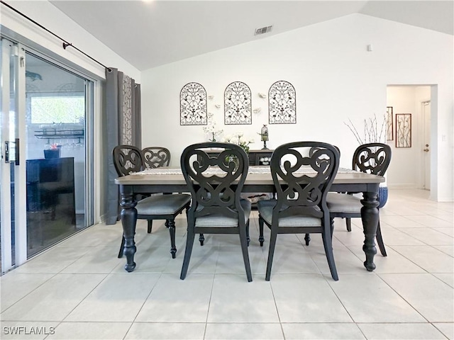 3790 35th Ave NE, Naples, FL 34120 - dining space with vaulted ceiling and light tile patterned flooring