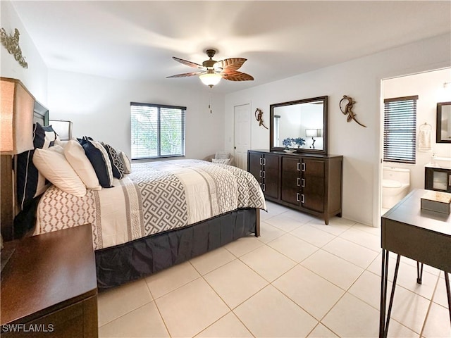 3790 35th Ave NE, Naples, FL 34120 - bedroom featuring light tile patterned floors, ensuite bath, and ceiling fan