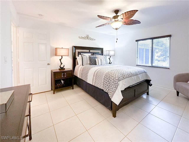 3790 35th Ave NE, Naples, FL 34120 - bedroom with light tile patterned floors and a ceiling fan