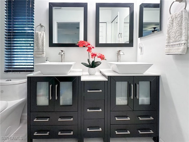 3790 35th Ave NE, Naples, FL 34120 - full bathroom with double vanity and toilet