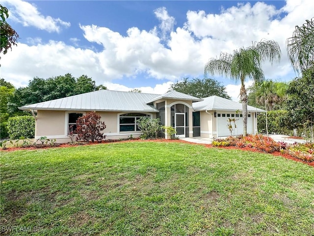3790 35th Ave NE, Naples, FL 34120 - single story home featuring stucco siding, a garage, a metal roof, and a front yard