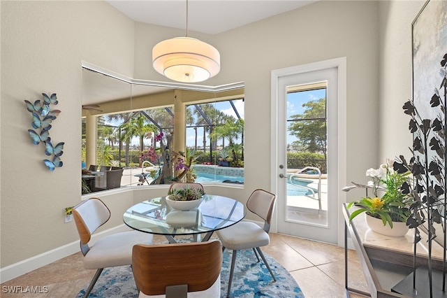 5687 Whispering Willow Way, Fort Myers, FL 33908 - tiled dining space featuring baseboards