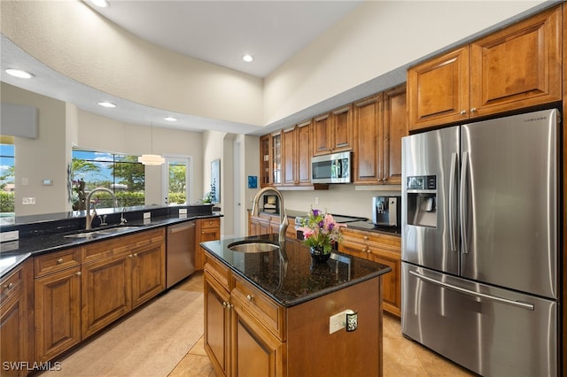 5687 Whispering Willow Way, Fort Myers, FL 33908 - kitchen featuring appliances with stainless steel finishes, a sink, brown cabinets, and recessed lighting