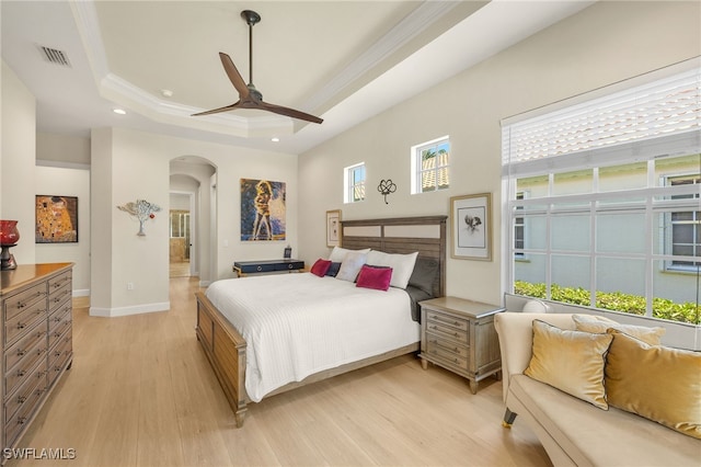 5687 Whispering Willow Way, Fort Myers, FL 33908 - bedroom with arched walkways, ornamental molding, light wood finished floors, a raised ceiling, and recessed lighting