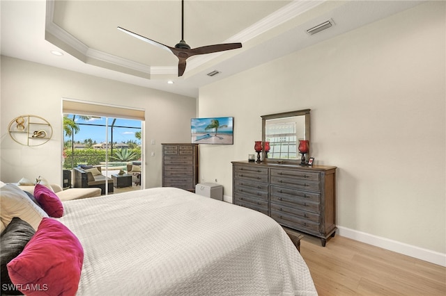 5687 Whispering Willow Way, Fort Myers, FL 33908 - bedroom with ornamental molding, access to exterior, a tray ceiling, baseboards, and light wood finished floors