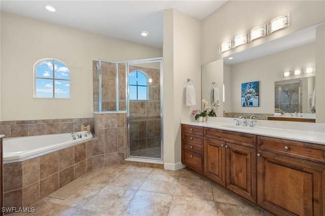 5687 Whispering Willow Way, Fort Myers, FL 33908 - full bath with plenty of natural light, vanity, a bath, a stall shower, and recessed lighting