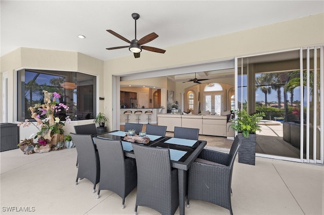 5687 Whispering Willow Way, Fort Myers, FL 33908 - view of patio / terrace with french doors, a ceiling fan, and outdoor dining area