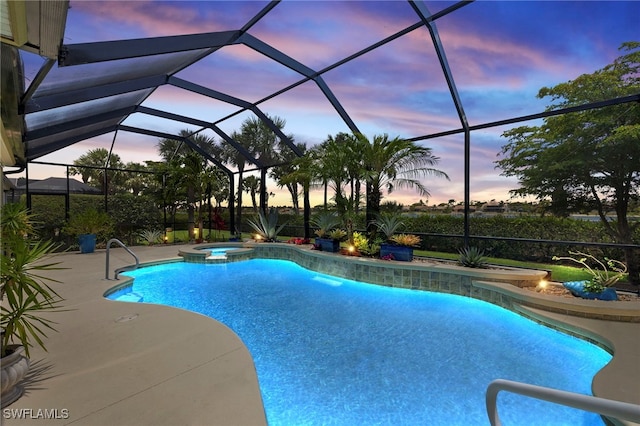 5687 Whispering Willow Way, Fort Myers, FL 33908 - pool at dusk with a pool with connected hot tub, a patio, and glass enclosure