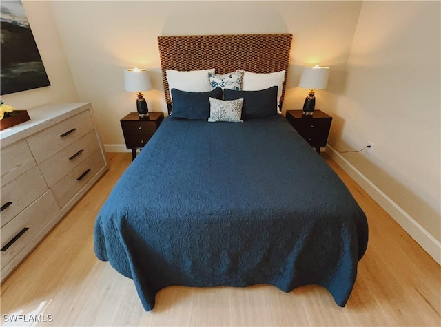 5687 Whispering Willow Way, Fort Myers, FL 33908 - bedroom featuring light wood-style floors and baseboards