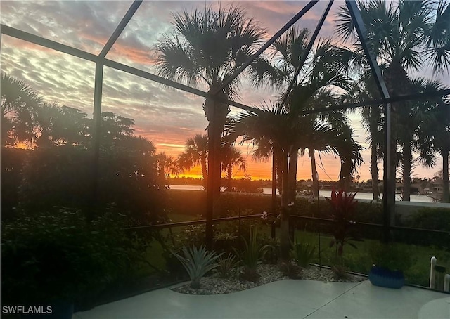 5687 Whispering Willow Way, Fort Myers, FL 33908 - view of patio / terrace featuring glass enclosure