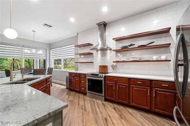 kitchen featuring appliances with stainless steel finishes, a sink, open shelves, crown molding, and light wood-style flooring