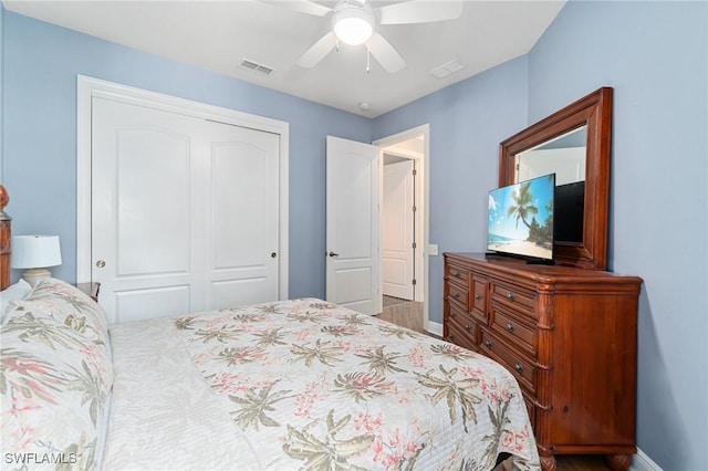 bedroom featuring a closet, baseboards, and ceiling fan